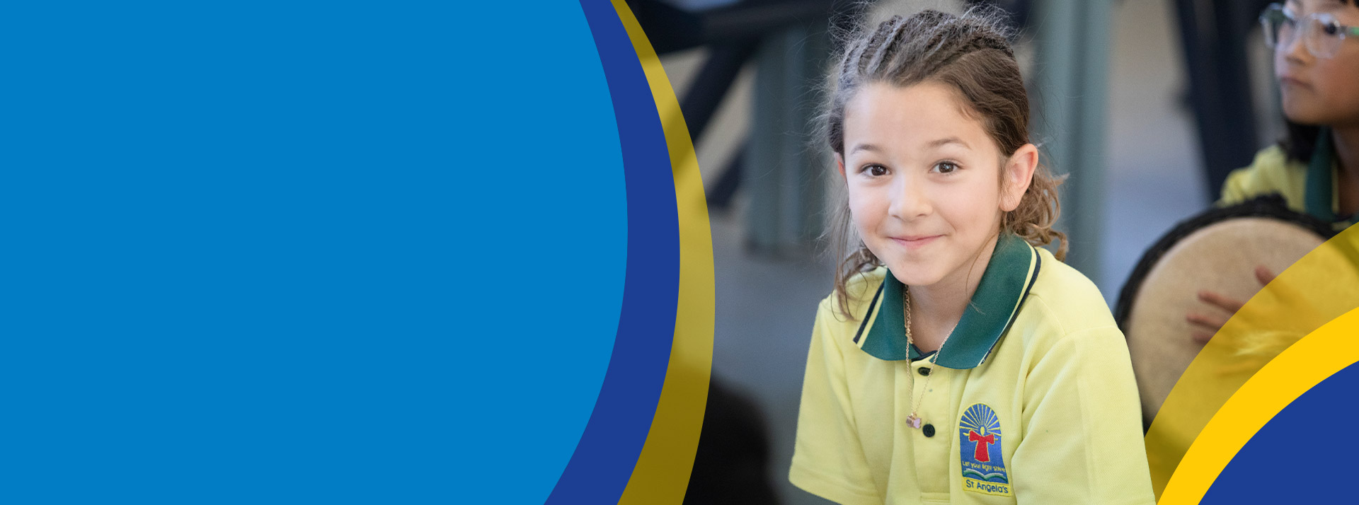 Student smiling in the classroom at St Angela's Primary School Castle Hill