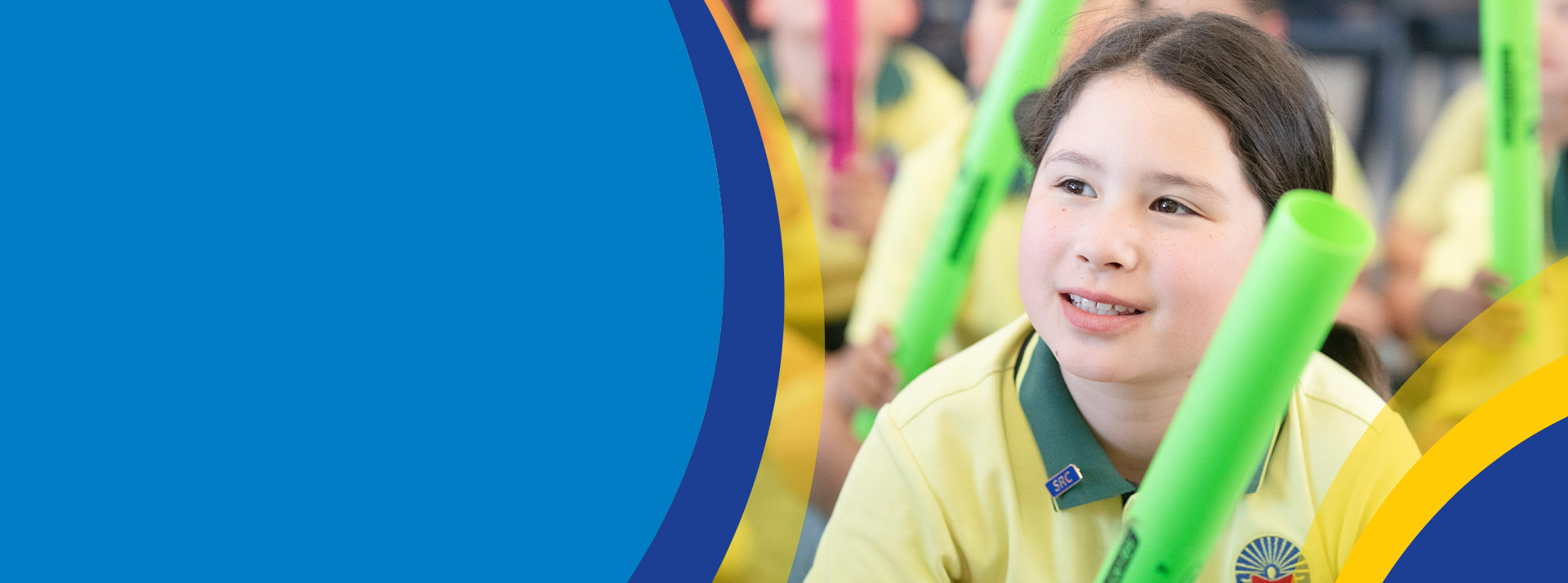 Student smiling in the classroom at St Angela's Primary School Castle Hill