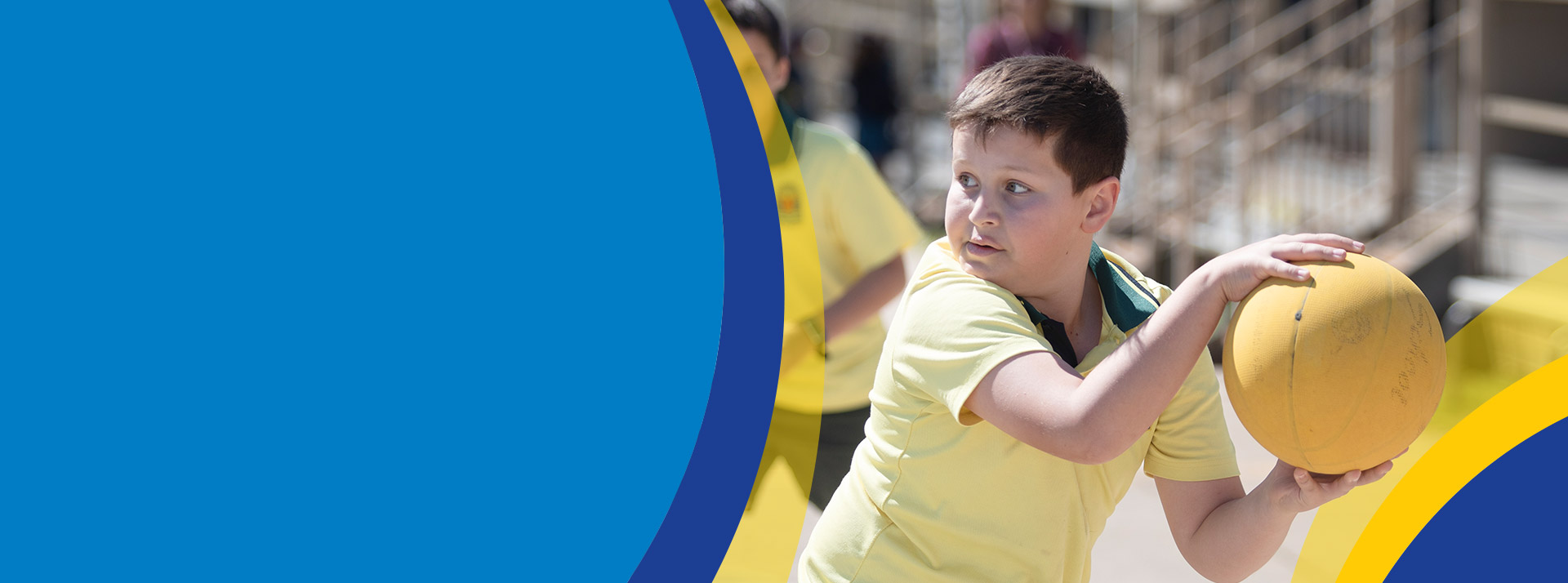 Students playing netball together on the playground at St John's Primary School Riverstone