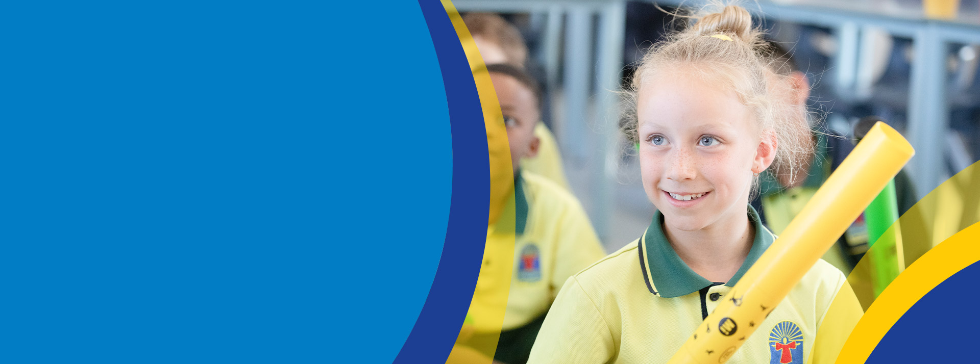 Student smiling in the classroom at St Angela's Primary School Castle Hill
