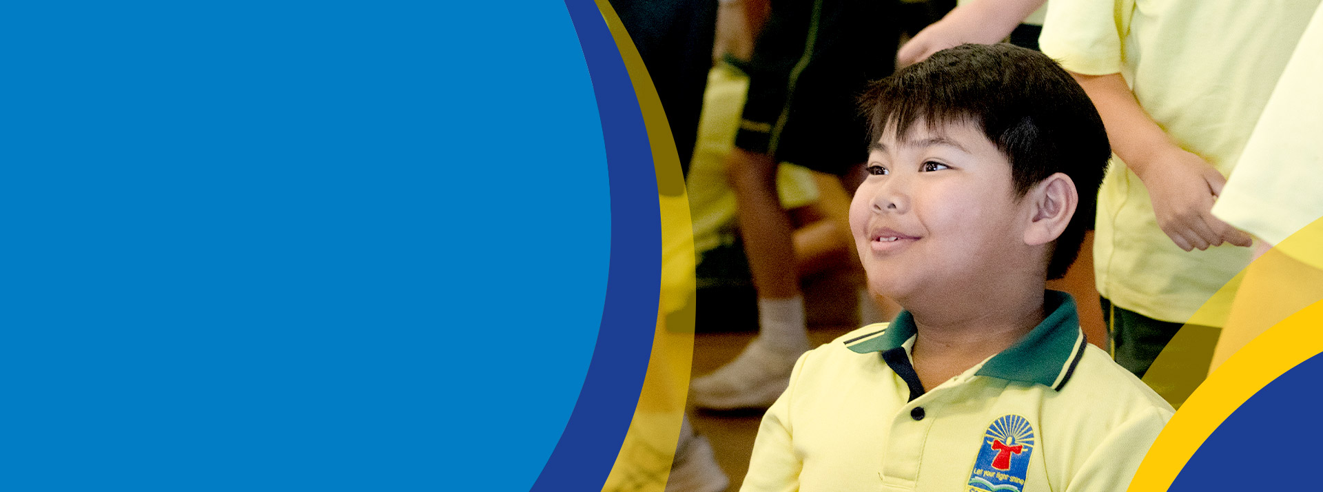 Student smiling in the classroom at St Angela's Primary School Castle Hill