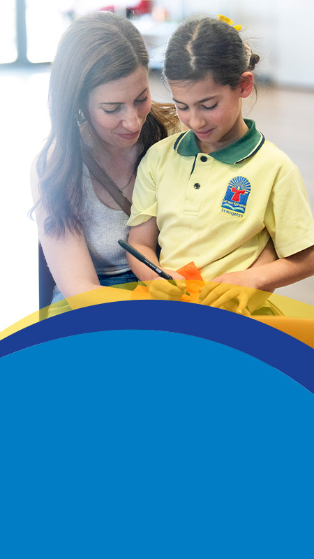 Student with her mother at a school event at St Angela's Primary School Castle Hill