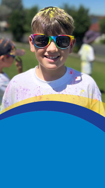 Student after a colour run at St Angela's Primary School Castle Hill