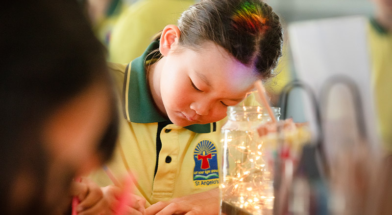 Student learning in the classroom at St Angela's Primary School Castle Hill