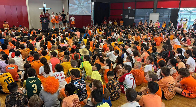 Students at a school mass on Harmony Day at St Angela's Primary School Castle Hill