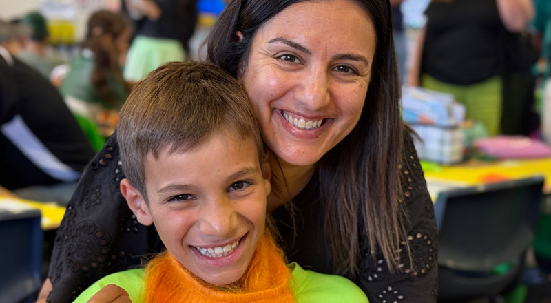 Mother with her son at a school event at St Angela's Primary School Castle Hill