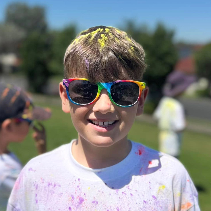 Student after a colour run at St Angela's Primary School Castle Hill
