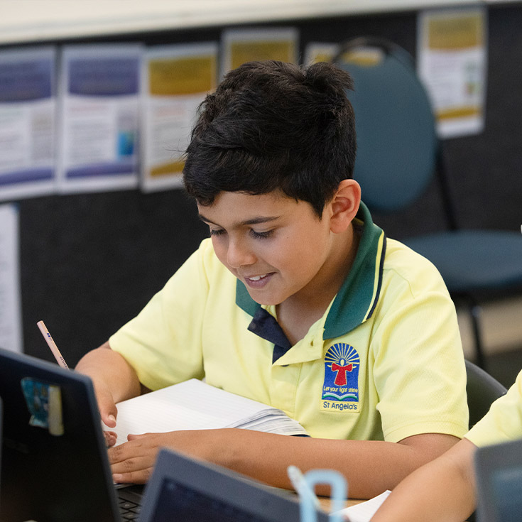 Student learning in the classroom at St Angela's Primary School Castle Hill