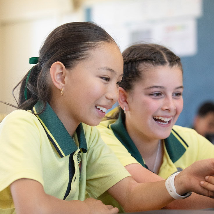 Students working together in the classroom at St Angela's Primary School Castle Hill