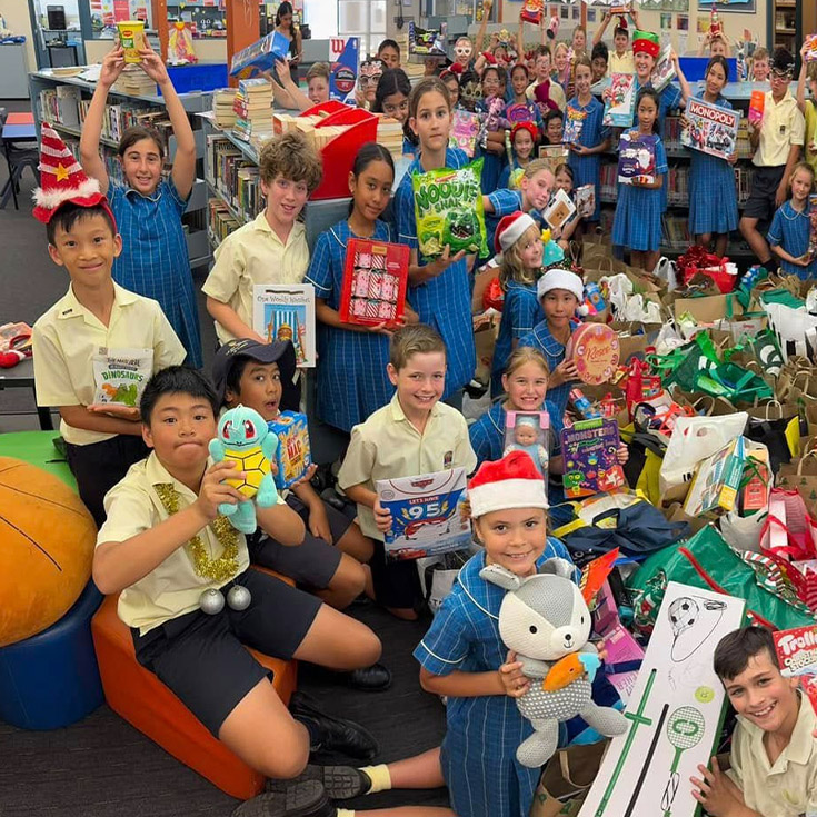 Students donating items to charity at St Angela's Primary School Castle Hill